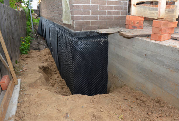 Happy homeowners after waterproofing job in Marlton